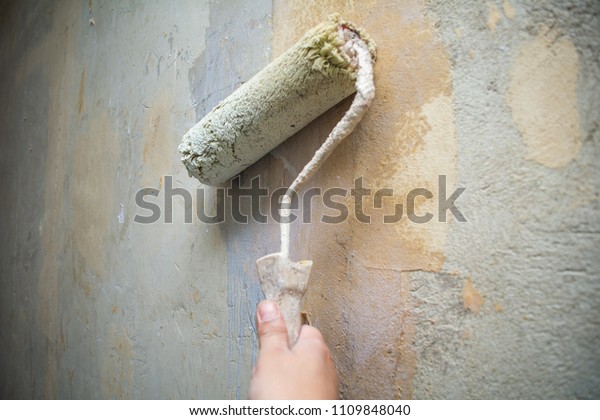 Closeup Hand Holds Rolling Paint Brush Stock Photo Edit Now