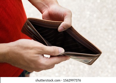 A Closeup Hand Man Open An Empty Wallet.