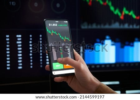 Closeup hand mobile decreasing graphs - Person is checking Bitcoin price chart on digital exchange on smartphone, cryptocurrency - Lose money, down, depression, collapse economy