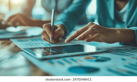 Close-up of a hand, modern business team using tablet   - Powered by Shutterstock