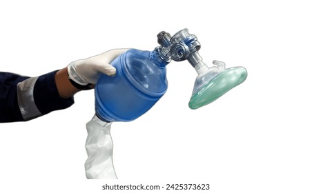 Closeup of the hand of a paramedic using bag valve mask, isolated white background