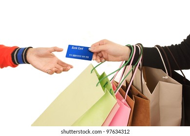 Close-up of hand passing over credit card to shop assistant after shopping MasterCard