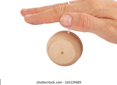 closeup of a hand playing yo-yo over white background