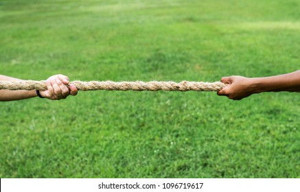 Closeup Of Hand Pulling The Rope In Tug Of War Game