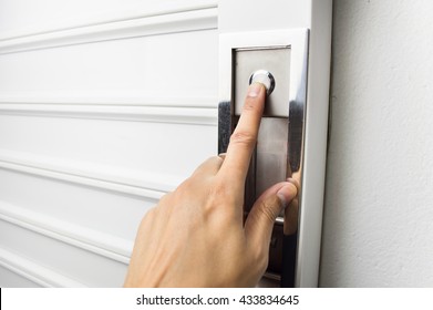 Closeup Of Hand Pushing The Button To Open The Garage Door