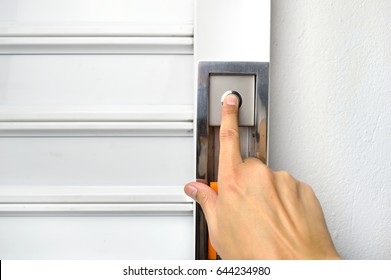 Closeup Of Hand Pushing The Button To Open The Garage Door