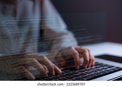 Close-up of hand of software developer writing code on laptop.