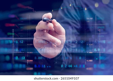 A close-up of a hand with a stylus interacting with a digital stock market chart. The overlay of candlestick graphs, buy and sell signals and numerical data