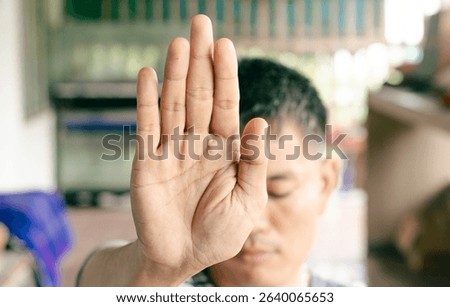 Close-up of hand symbolizing refusal