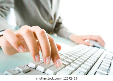 Close-up of secretary’s hand touching computer keys during work