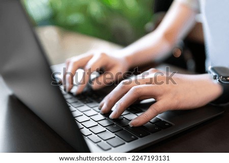 closeup hand typing keyboard on labtop of businesswoman work during technology online connection business work for education and study business concept
