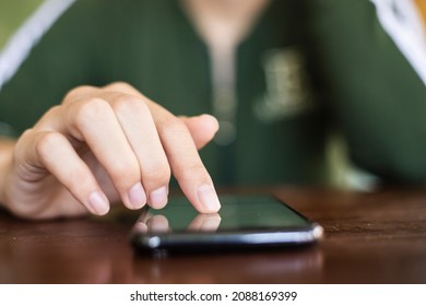 Close-up woman’s hand typing message. concept of shopping or planning business on touchphone. Businesswoman using wireless device. - Shutterstock ID 2088169399