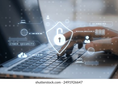 Close-up of a hand typing on a laptop keyboard with holographic cybersecurity icons overlay. Blue digital background. Concept of online protection and data safety - Powered by Shutterstock