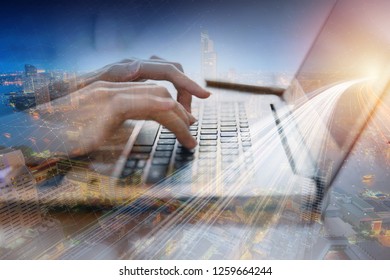 closeup hand using computer laptop with overlay fast speed communication connection concept.