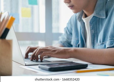 Closeup hand using computer laptop. Using online connect technology for business, education and communication. 