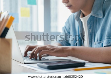 Closeup hand using computer laptop. Using online connect technology for business, education and communication. 