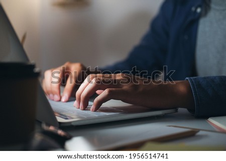 Closeup hand using computer laptop. Using online connect technology for business, education and communication. 