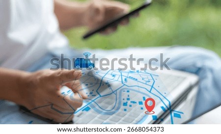 Close-up hand using a GPS tracking map with a smart car icon and a location pin on a digital screen. Concept of real-time navigation, transport, and mobility.