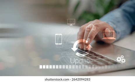 Close-up hand using laptop with system update progress bar and cloud sync icons. Concept of software upgrade, digital transformation, and technology maintenance in modern connected devices.