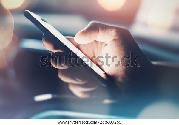 Closeup of hand using smartphone with effects