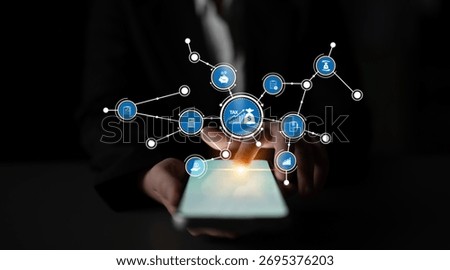 A close-up of a hand using a smartphone, surrounded by digital icons representing various financial applications and services in a modern tech environment. Tessel