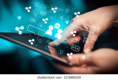 Close-up of a hand using tablet, social media concept - Shutterstock ID 2176685245