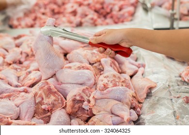 Close-up Hand Woman Shopping For Chicken Meat In A Store