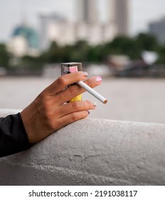 Closeup Hand Woman Teen Young Asia One Person Wearing A Black Shirt Hold Smoking Cigarette White Color Standing Outdoor By The Wall 