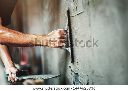 closeup hand of worker plastering cement at wall for building house                                 ストックフォト © 