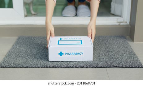 Close-up hand young asia woman pick up covid free first aid self recover health care give to help patient people buy online clinic retail Rx drugstore in telehealth telemedicine e-commerce home order. - Powered by Shutterstock