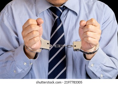 Close-up Of A Handcuffed Businessman.