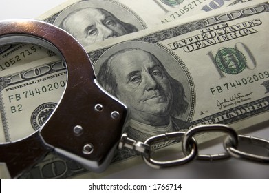 Close-up Handcuffs And Money