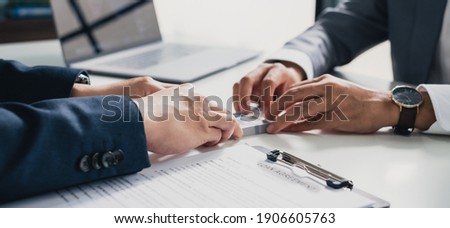 Closeup hands banker giving cash money to businessman, loan and credit financial lease concept