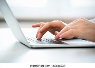 Close-up Of Hands Of Business Man Typing On A Laptop.