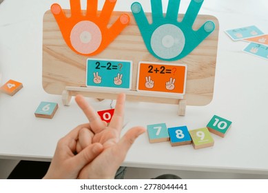 Close-up of hands counting numbers using fingers. Simple and effective method for teaching basic math concepts to children.