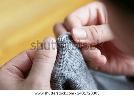 Close-up of hands doing needlework