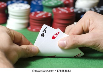 Closeup of hands with double ace