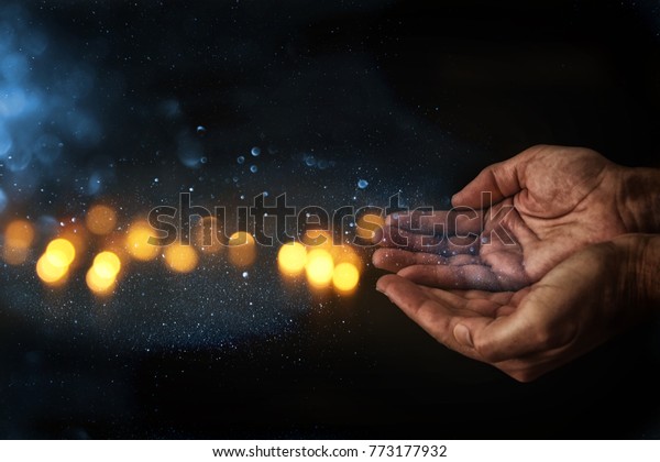 closeup hands of\
elderly man begging for help. concept for poverty or hunger or\
seeking for light in the\
dark