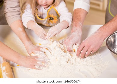 Close-up Hands Of Family Are Baking Cakes In Home Kitchen.