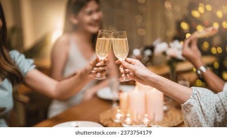 Closeup hands with glasses of champagne wine clink in christmas celebrate party festive
 - Powered by Shutterstock