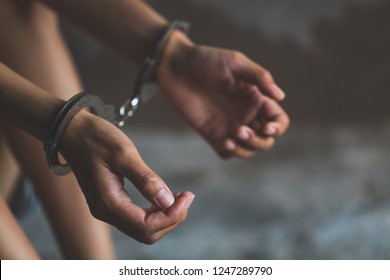 Close-up Of Hands In Handcuff,  Female Prisoner, Arrested Woman Handcuffed Hands. Prisoner Or Arrested Terrorist, Hacker, Bribetaker. 