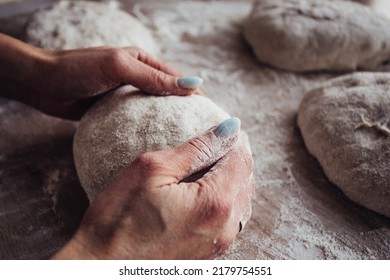 Close-up of hands holding dough . Baking chiabatta or pizza. Home made bread. Home bakery - Shutterstock ID 2179754551