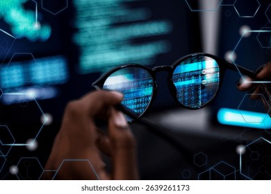 Close-up of hands holding glasses reflecting binary code. Technology and data concept with a focus on coding and digital information. Futuristic tech vibe. Business and technology.