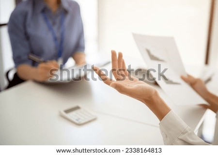 Close-up hands image of a professional businessman talking and discussing work with a female colleague in the meeting.