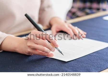 closeup hands of learning penmanship
