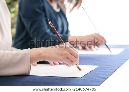 closeup hands of learning penmanship
