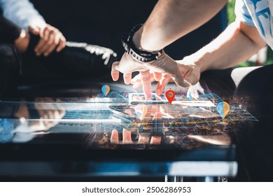 Close-up of hands manipulating a futuristic digital map interface with location markers, highlighting modern technology in navigation and planning.