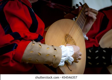 Closeup Of The Hands Of A Medieval Court Musician Playing The Lute