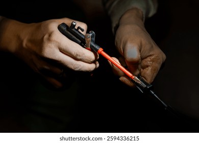 A Close-Up of Hands Modifying a Firearm with Precision Tools.