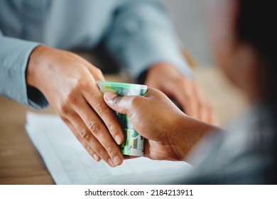 Closeup Of Hands, Money Exchange Between Businesswoman And Customer For Delivery Or Services Done. A Dishonest Man Accepting A Bribery For Deal. Boss Paying Worker His Salary Or Tips Earned.